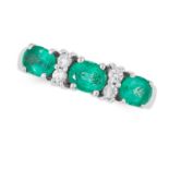 AN EMERALD AND DIAMOND RING set with alternating oval cut emeralds and round cut diamonds, tests