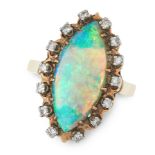 AN OPAL AND DIAMOND RING in yellow gold, set with a marquise shaped cabochon opal of 3.98 carats