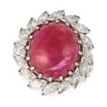 A BURMA NO HEAT RUBY AND DIAMOND RING set with an oval cabochon ruby of approximately 12.0 carats