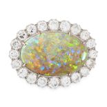 AN OPAL AND DIAMOND BROOCH set with a large oval opal cabochon of 16.56 carats within a border of