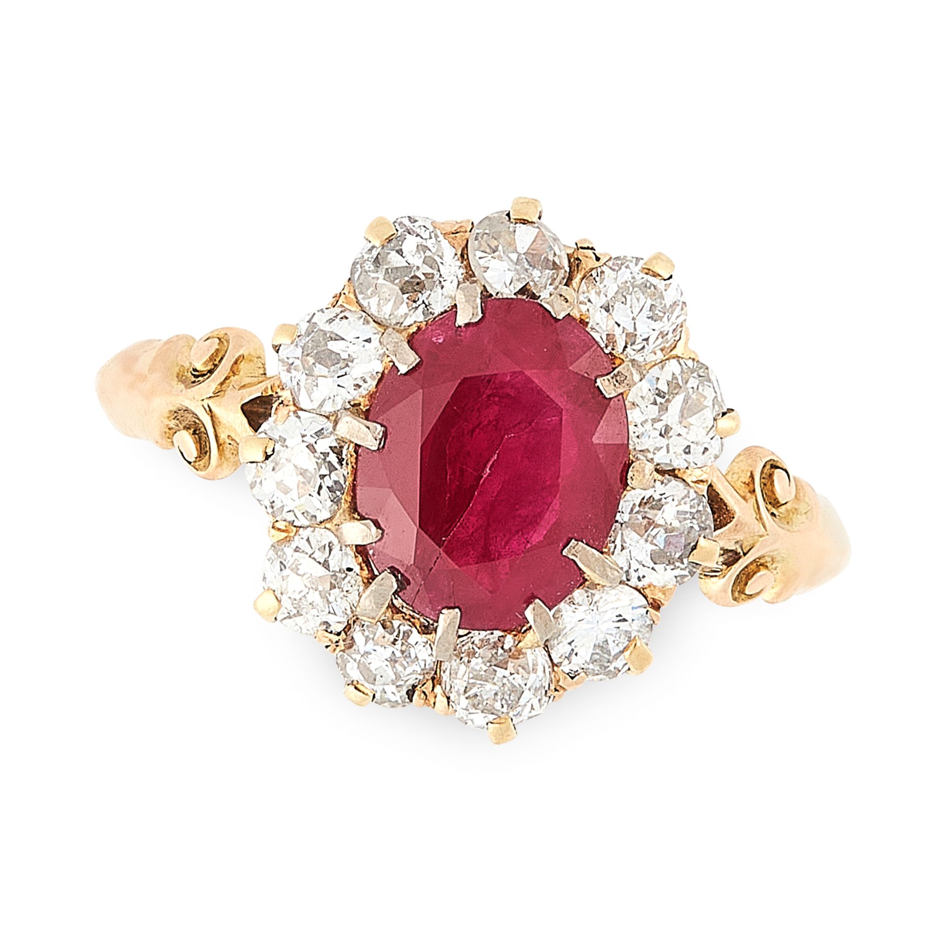 AN ANTIQUE BURMA NO HEAT RUBY AND DIAMOND CLUSTER RING in high carat yellow gold, set with an oval