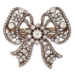 AN ANTIQUE DIAMOND BOW BROOCH, CARTIER LATE 19TH CENTURY in 18ct yellow gold and silver, designed as