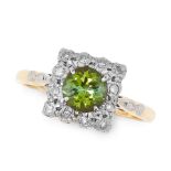 A TOURMALINE AND DIAMOND RING in 18ct yellow gold and platinum, set with a round cut green