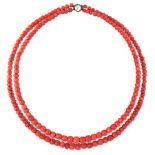 AN ANTIQUE TWO ROW CORAL AND PASTE NECKLACE comprising two graduated rows of polished coral beads