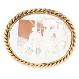 AN ANTIQUE CAMEO BROOCH, 19TH CENTURY in pinchbeck, of oval form, carved to depict a domestic