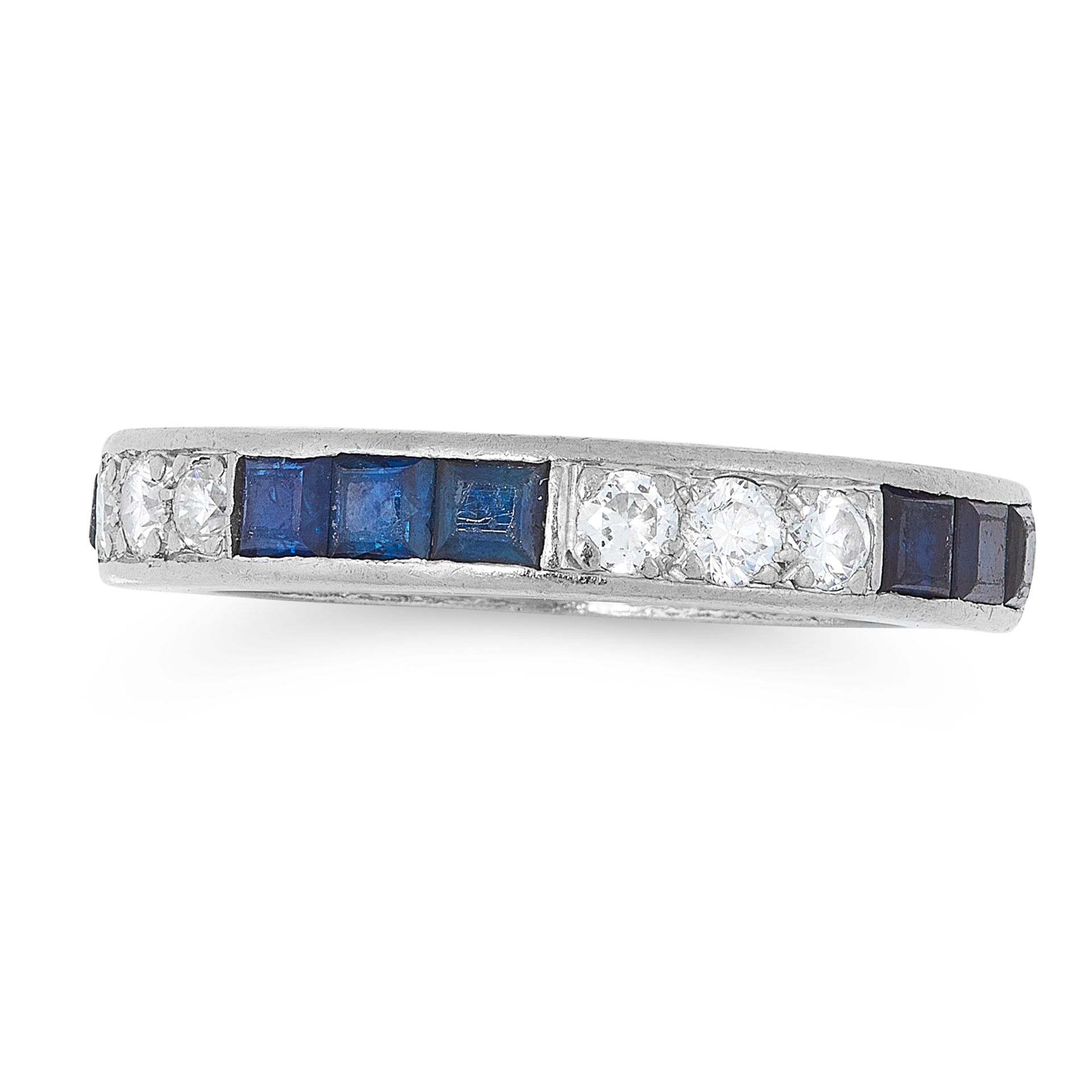 A SAPPHIRE AND DIAMOND ETERNITY RING CIRCA 1940 in platinum, designed as a band of alternating trios