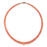 AN ANTIQUE CORAL BEAD NECKLACE comprising a single row of seventy-three graduated polished coral