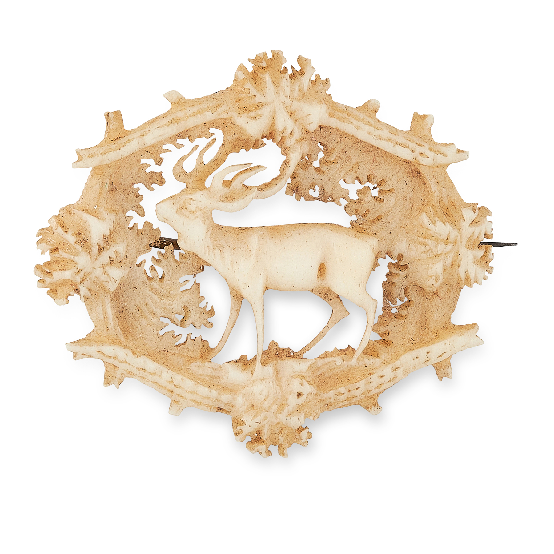 AN ANTIQUE VICTORIAN CARVED BONE BROOCH, 19TH CENTURY carved to depict a deer among foliage,