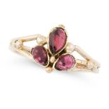 AN ANTIQUE GARNET DRESS RING in yellow gold, set with a trio of cabochon garnets to a bifurcated