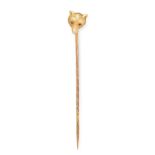 A RUBY FOXES HEAD TIE PIN in yellow gold, designed as the head of a fox set with ruby eyes,