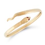 A SNAKE BANGLE in 18ct yellow gold, designed as the body of a snake coiled around on itself, set