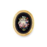 AN ANTIQUE MICROMOSAIC BROOCH comprising of an oval polished onyx face set with a micromosaic