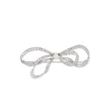 AN ANTIQUE DIAMOND BOW BROOCH in platinum, designed as a double looped bow, set with 3.8-4.2