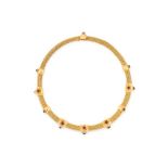 A GEMSET TORQUE NECKLACE, ILIAS LALAOUNIS in 18ct yellow gold, comprising of an interwoven pipe