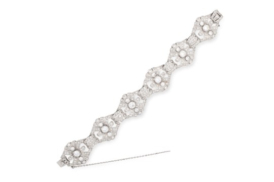 A DIAMOND BRACELET in platinum, in Art Deco design, comprising of six principal openwork links set