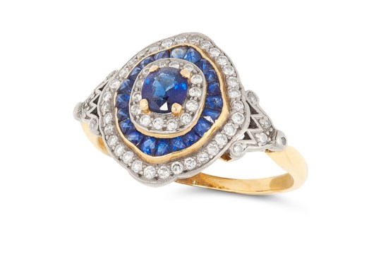 A SAPPHIRE AND DIAMOND TARGET RING, CIRCA 1950 in 18ct yellow gold, set with an oval cut sapphire in - Image 2 of 2