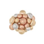 A TRICOLOUR GOLD BALL RING in white, yellow and rose gold, set with textured balls of white,