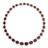 AN ANTIQUE GARNET RIVIERE NECKLACE, 19TH CENTURY in 18ct yellow gold, comprising a single row of