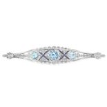 AN AQUAMARINE, SAPPHIRE AND DIAMOND BROOCH, EARLY 20TH CENTURY in 18ct white gold, the body set with