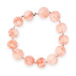 A CHINESE CORAL BRACELET comprising a single row of thirteen carved coral beads of 13.5mm with