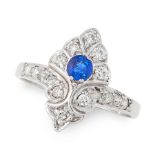 A SAPPHIRE AND DIAMOND DRESS RING of shield design, set with a round cut sapphire accented by