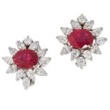 A PAIR OF RUBY AND DIAMOND EARRINGS in 18ct white gold, each set with an oval cut ruby of 3.46 and