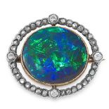A BLACK OPAL AND DIAMOND BROOCH, CIRCA 1900 in yellow gold and silver, set with an oval cabochon