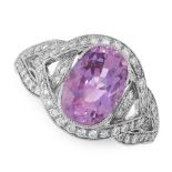 A CEYLON NO HEAT PINK SAPPHIRE AND DIAMOND RING in 18ct white gold, set with an oval cut pink