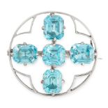 AN ANTIQUE ZIRCON BROOCH, EARLY 20TH CENTURY of circular design, set with five emerald cut blue