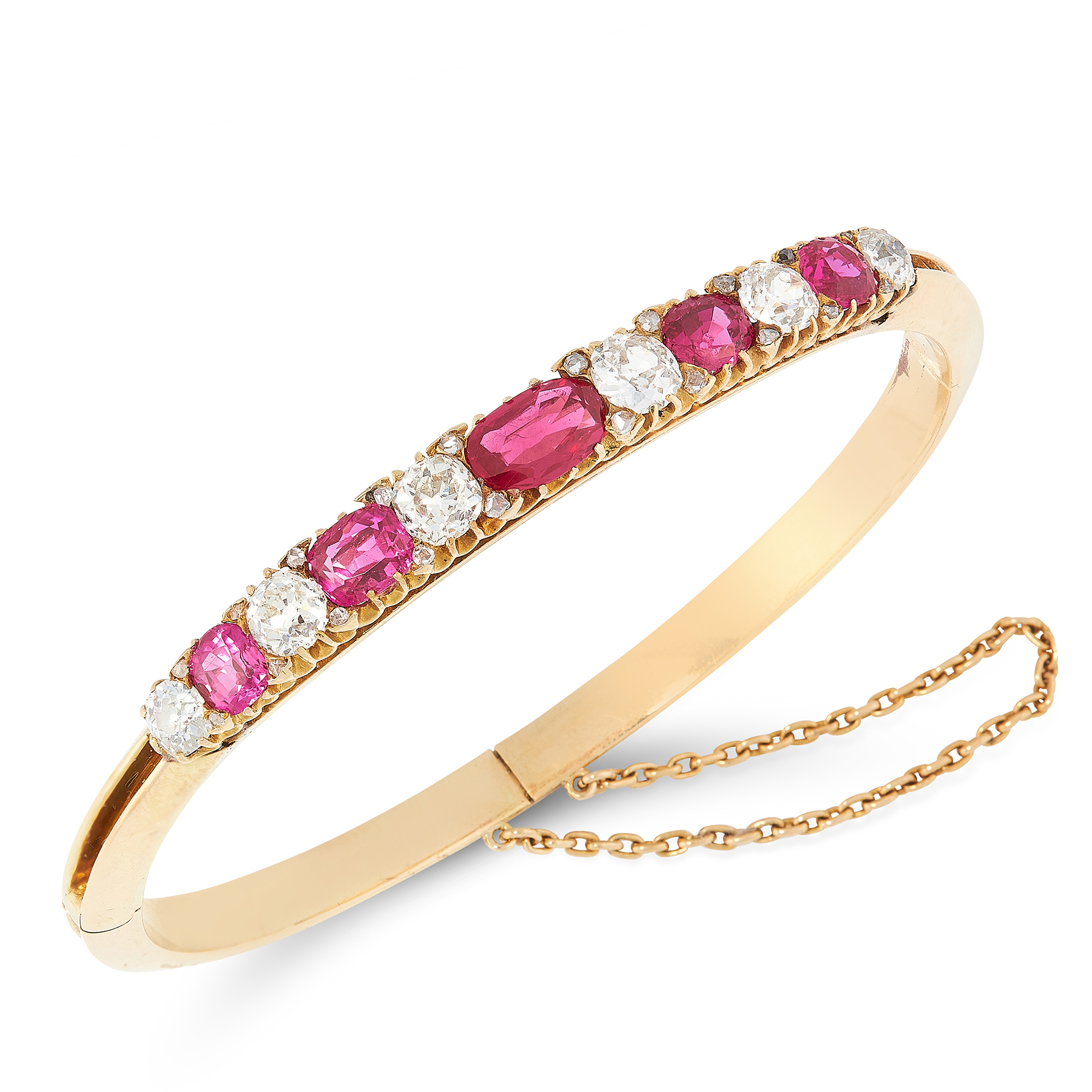 AN ANTIQUE BURMA NO HEAT RUBY AND DIAMOND BANGLE in 18ct yellow gold, set with five graduated oval
