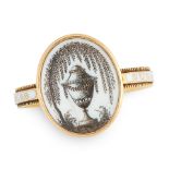 AN ANTIQUE ENAMEL HAIRWORK MINIATURE MOURNING RING, CIRCA 1780 in high carat yellow gold, the oval