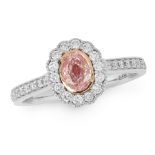 A PINK DIAMOND DRESS RING in 18ct white gold, set with a central oval cut fancy light pink diamond