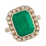 AN EMERALD AND DIAMOND CLUSTER RING set with an emerald cut emerald of 4.35 carats, in a cluster