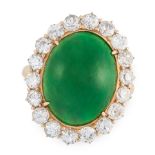 A JADEITE JADE AND DIAMOND RING in 18ct yellow gold, set with an oval jadeite cabochon of 12.40
