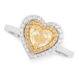 A FANCY YELLOW DIAMOND DRESS RING in 18ct white gold, set with a heart shaped brilliant cut fancy