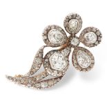 AN ANTIQUE DIAMOND BROOCH, 19TH CENTURY in yellow gold and silver, designed as a flower, set with