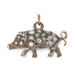 A RUBY AND DIAMOND PIGLET CHARM / PENDANT in yellow gold and silver, designed as a pig, jewelled