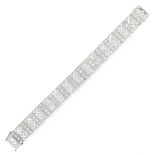 AN ART DECO DIAMOND BRACELET in platinum, the pierced open framework is set with old cut diamonds