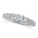 A DIAMOND DRESS RING set with a trio of princess cut diamonds accented by round cut diamonds to