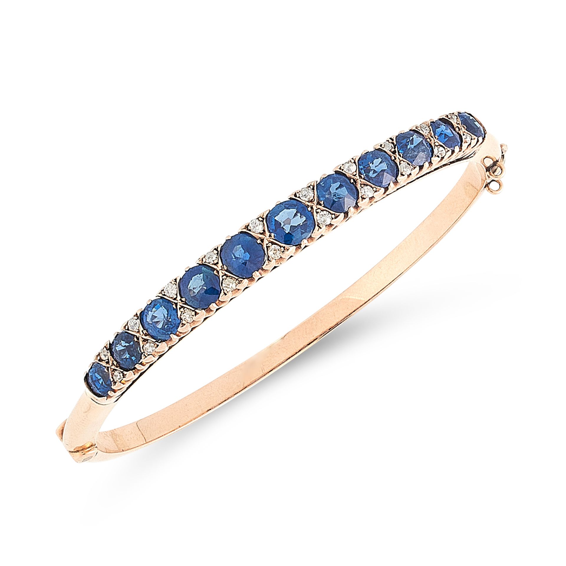 AN ANTIQUE SAPPHIRE AND DIAMOND BANGLE in high carat yellow gold, designed as a row of eleven
