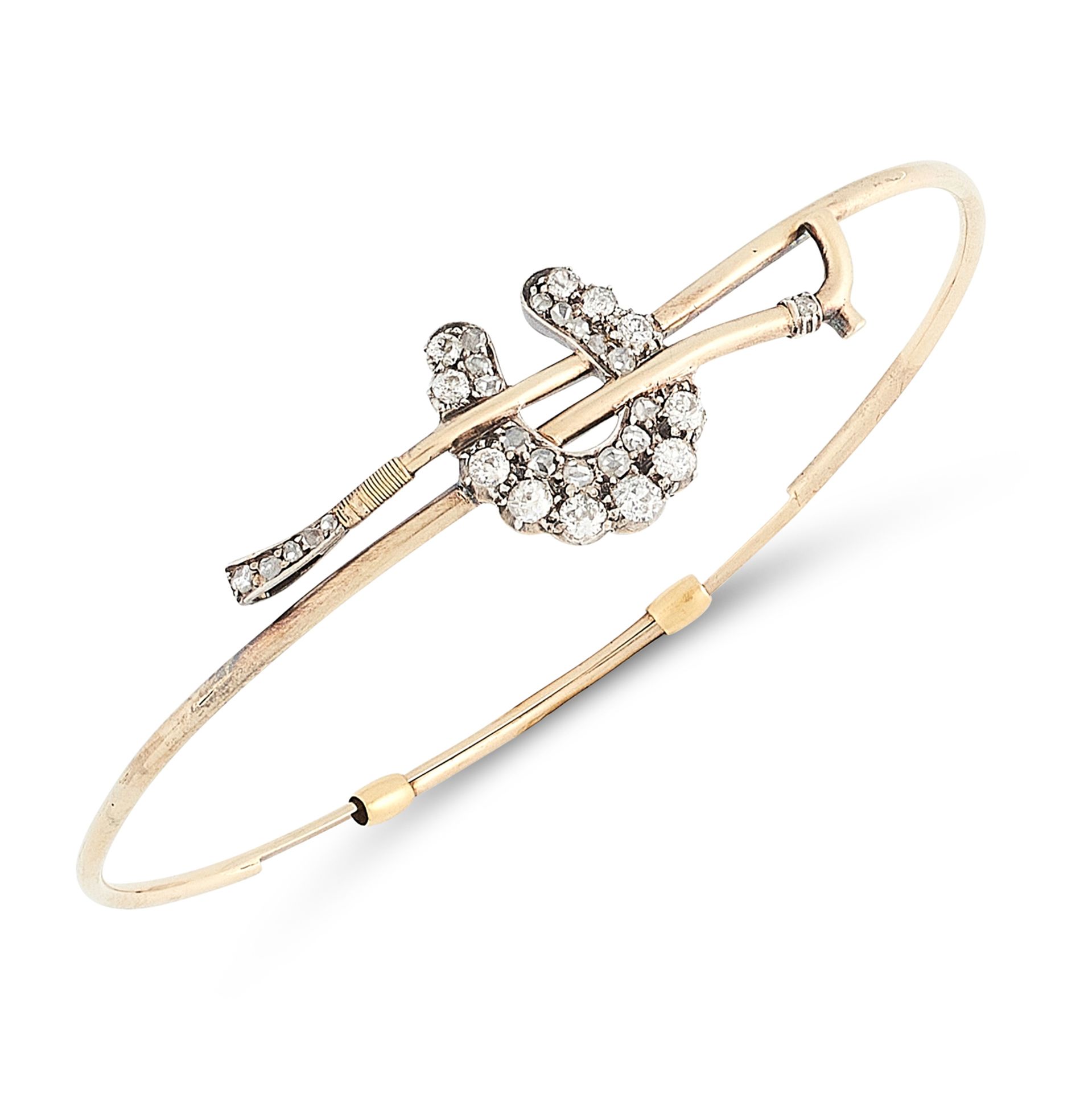 AN ANTIQUE DIAMOND BANGLE, 19TH CENTURY in yellow gold, designed as a riding crop, with applied