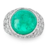 A COLOMBIAN EMERALD AND DIAMOND RING CIRCA 1980 in platinum, set with a circular cabochon emerald of