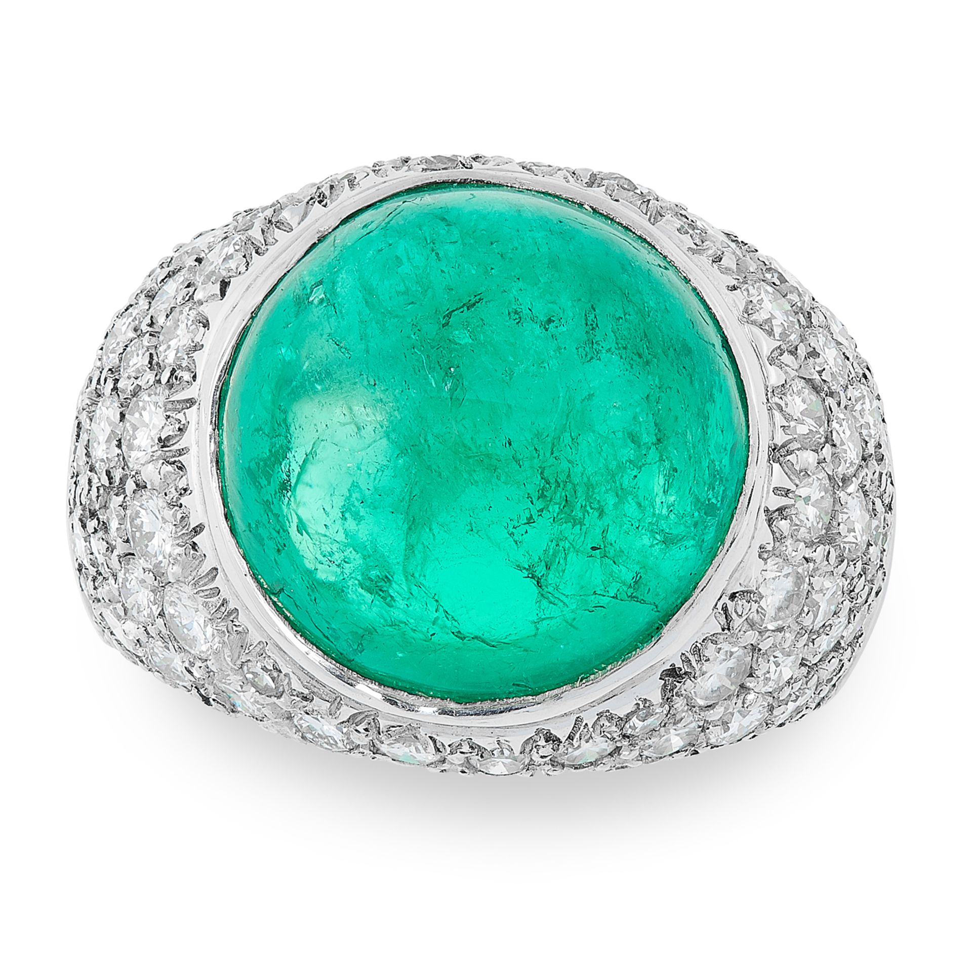 A COLOMBIAN EMERALD AND DIAMOND RING CIRCA 1980 in platinum, set with a circular cabochon emerald of