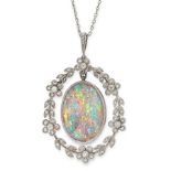 A BLACK OPAL AND DIAMOND PENDANT in yellow gold and silver, set with an oval cabochon black opal