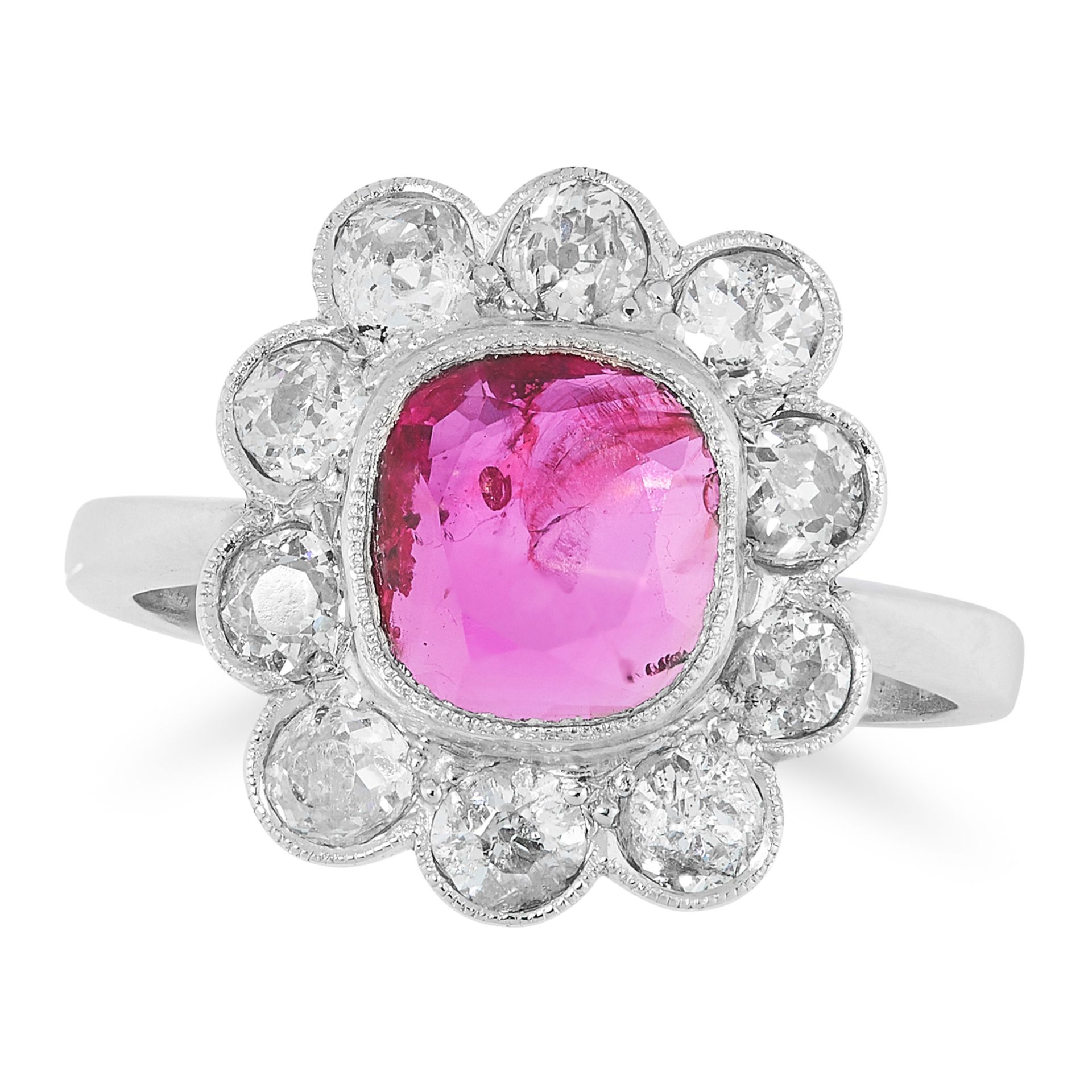 A BURMA NO HEAT RUBY AND DIAMOND RING CIRCA 1950 in platinum, set with a modified cushion cut ruby