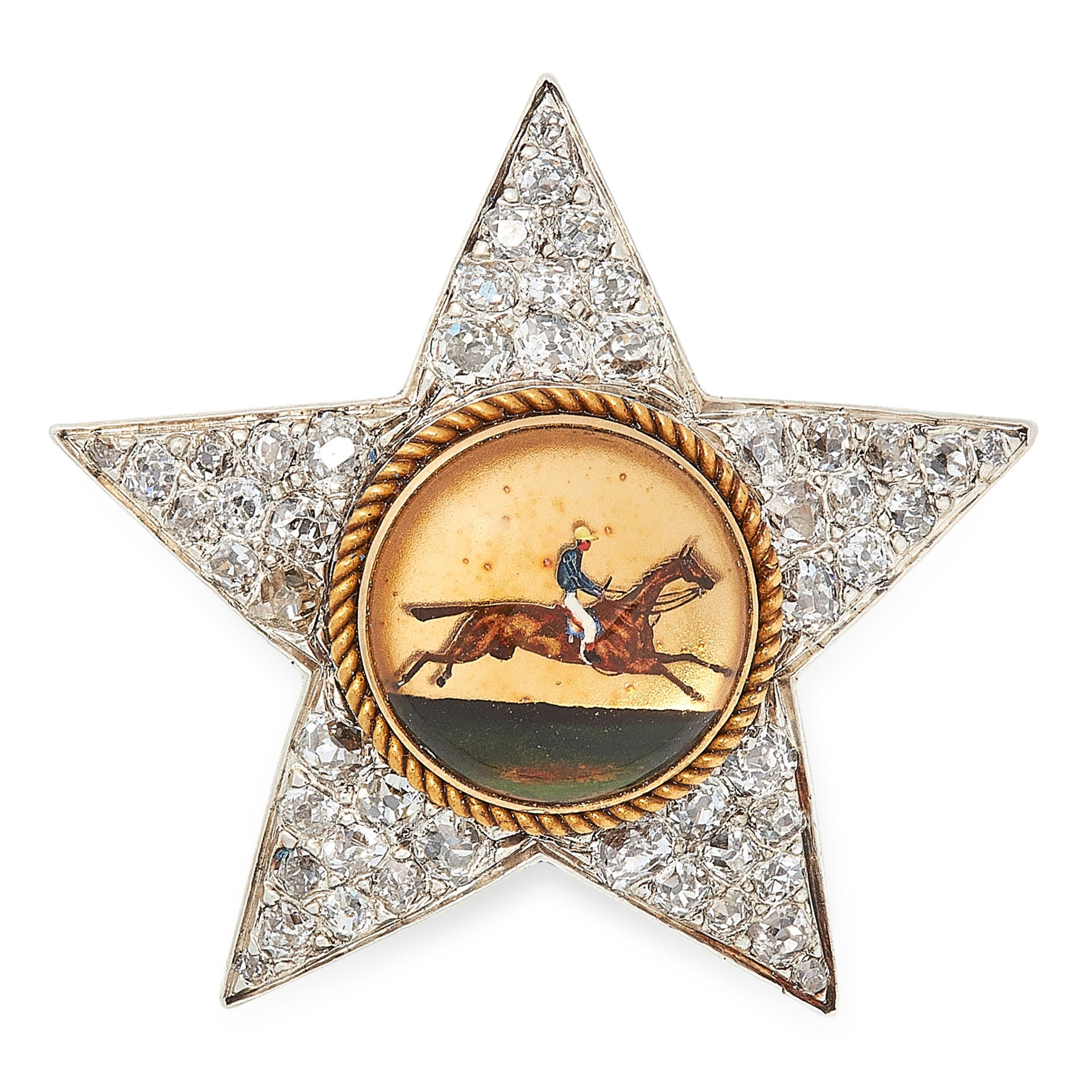 AN ANTIQUE REVERSE CARVED INTAGLIO AND DIAMOND BROOCH in yellow gold and silver, designed as a star,