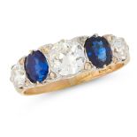 AN ANTIQUE SAPPHIRE AND DIAMOND RING in 18ct yellow gold, set with a trio of old cut diamonds of 0.