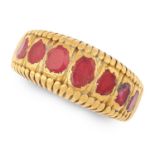 AN ANTIQUE RUBY DRESS RING in high carat yellow gold, set with seven graduated oval cut rubies,