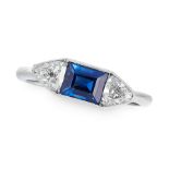 A SAPPHIRE AND DIAMOND THREE STONE RING set with a central step cut sapphire of 1.15 carats, between