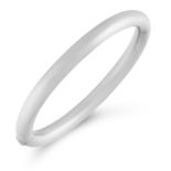 A VINTAGE BANGLE in platinum, designed as a plain tubular band with hinged opening, stamped Pt,